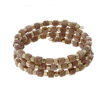 Mauve square natural stone and gold tone beaded coil bracelet.